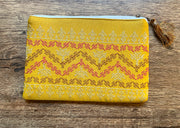Mustard maharani purse close-up highlighting embroidered border details